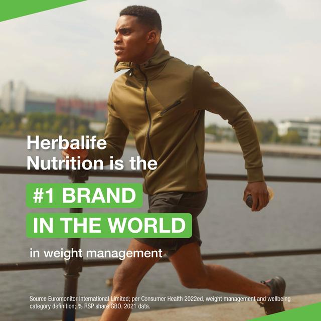 Man running with Herbalife Nutrition advertisement text overlay